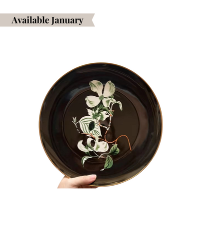 black bread plate featuring a high contrast floral design