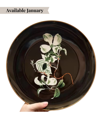 black charger plate featuring a high contrast floral design