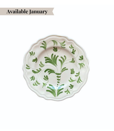 White ceramic bread plate with green floral pattern