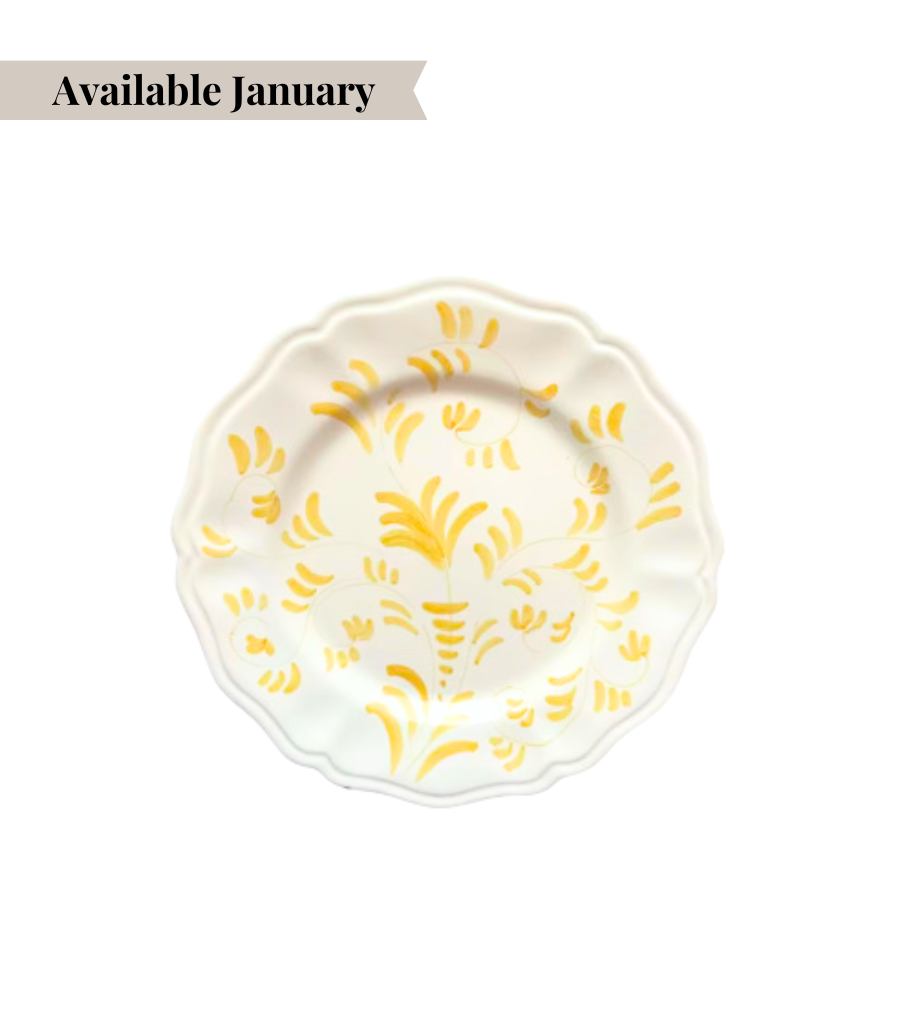 White ceramic bread plate with yellow floral pattern