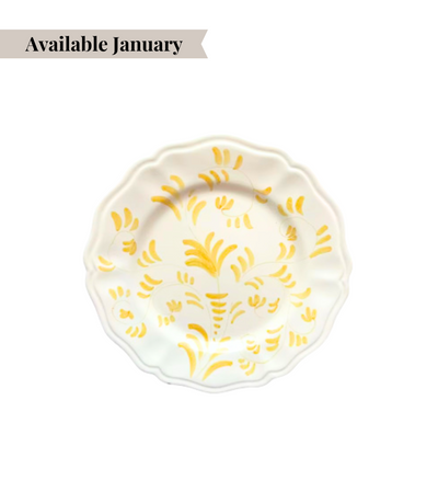 White ceramic bread plate with yellow floral pattern