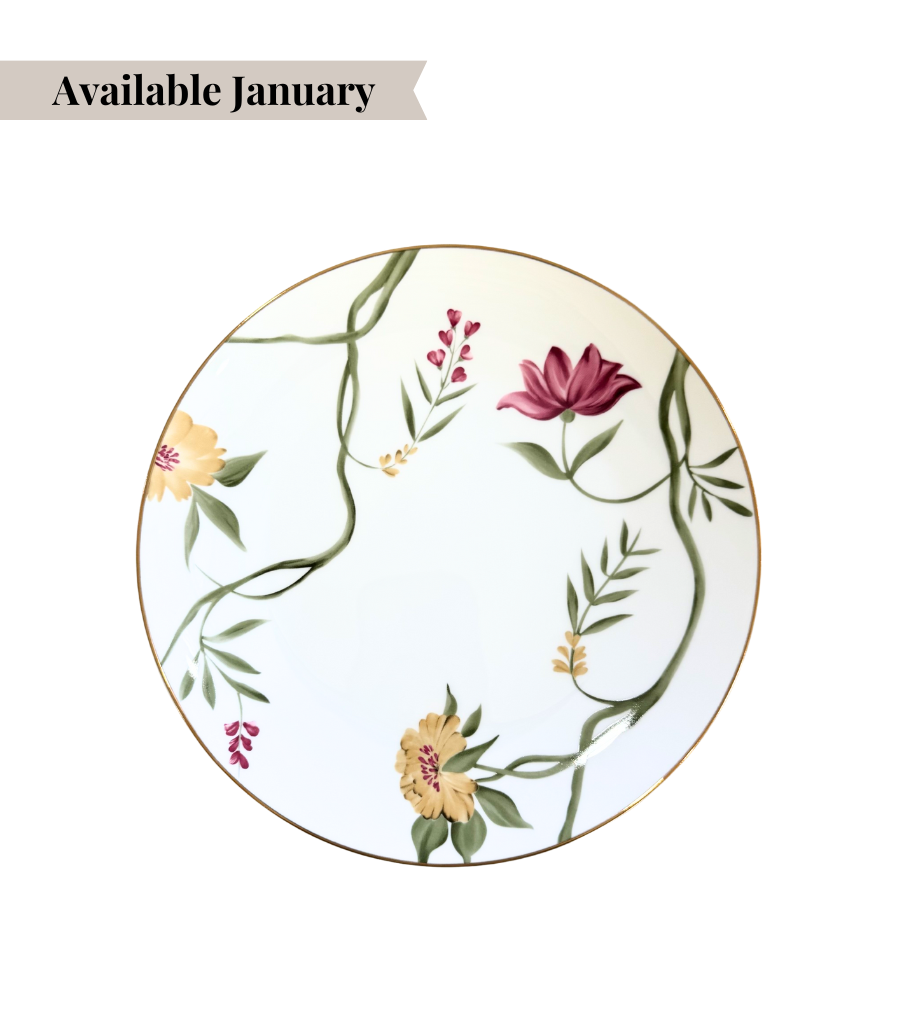 white porcelain dinner plate with floral design and gold trim