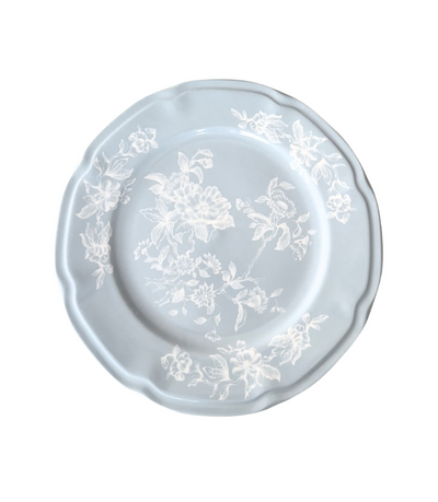 light blue dinner plate with white floral pattern