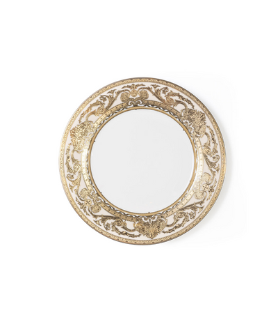white bread plate with intricate gold rim detailing 