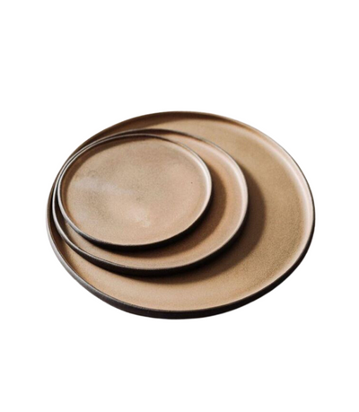 black stoneware charger plate with beige, yellow, brown colouring