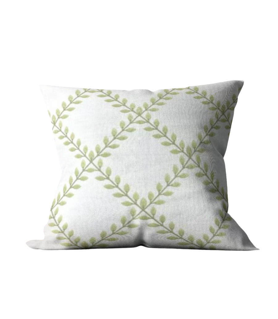 pillow with embroidered green leaf pattern