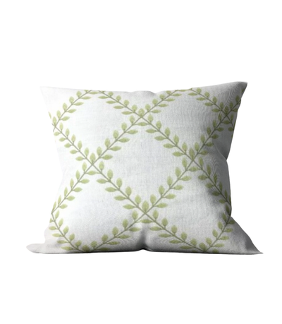pillow with embroidered green leaf pattern