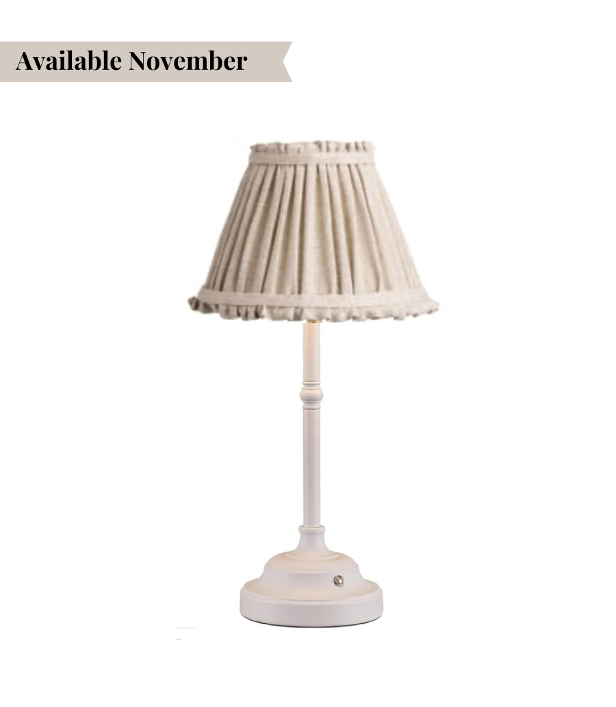 table lamp with white base and natural coloured shade
