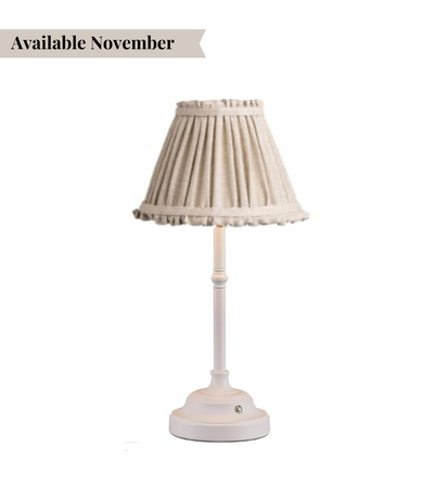table lamp with white base and natural coloured shade