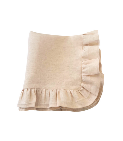 peach coloured linen napkin with ruffled edges 
