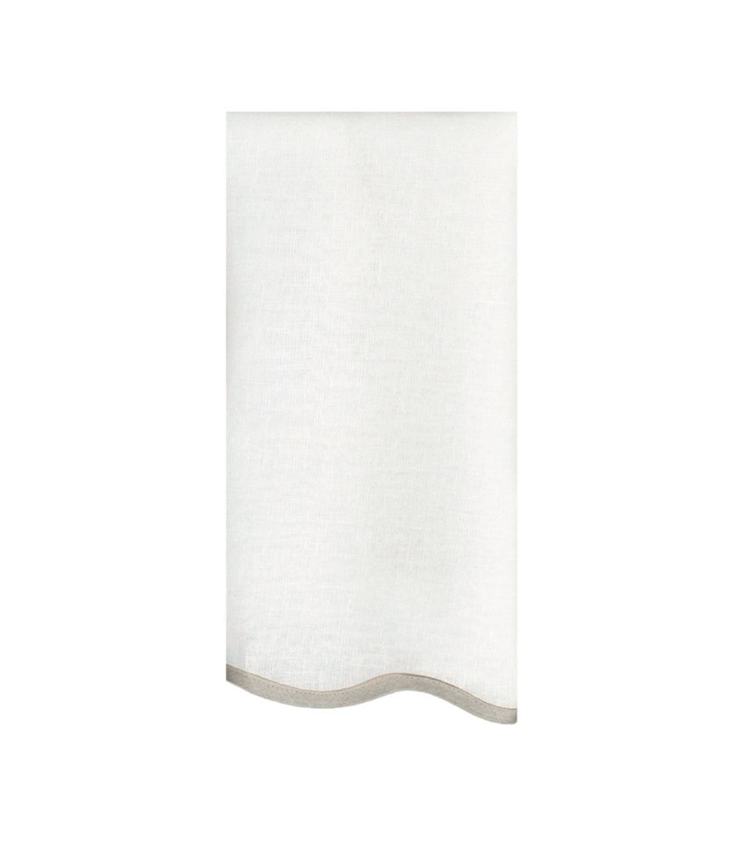white linen napkin with light brown trim scalloped edge