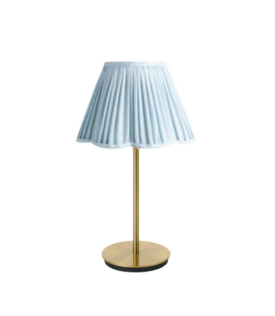 blue table lamp with scalloped edges and gold base