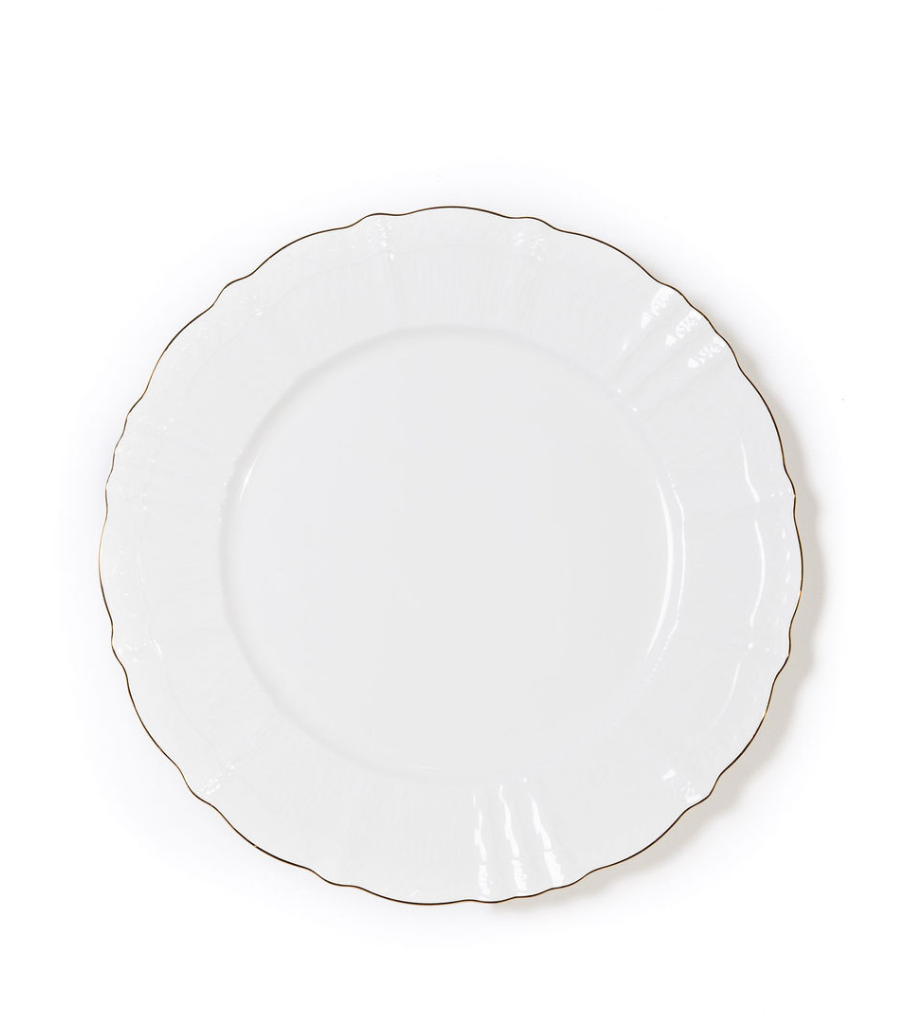White porcelain charger plate with a scalloped edge and a thin gold rim