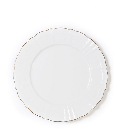 White porcelain charger plate with a scalloped edge and a thin gold rim