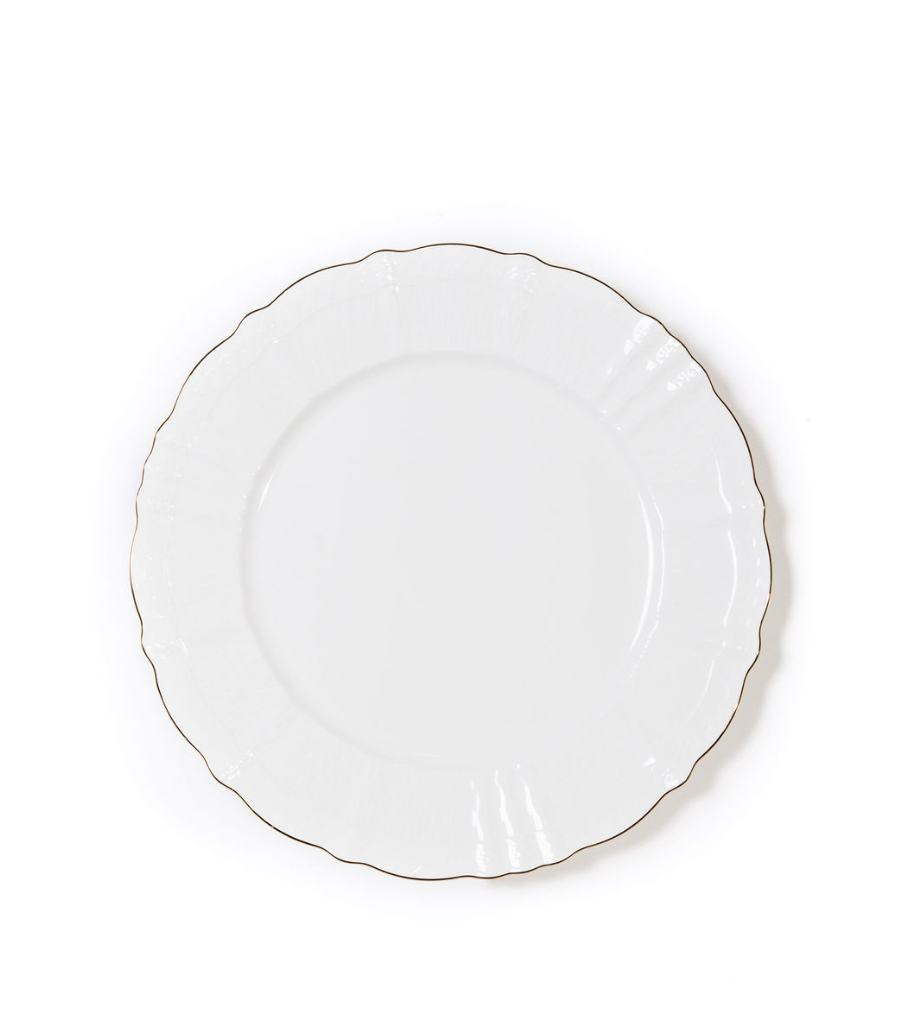 White porcelain dinner plate with a scalloped edge and a thin gold rim