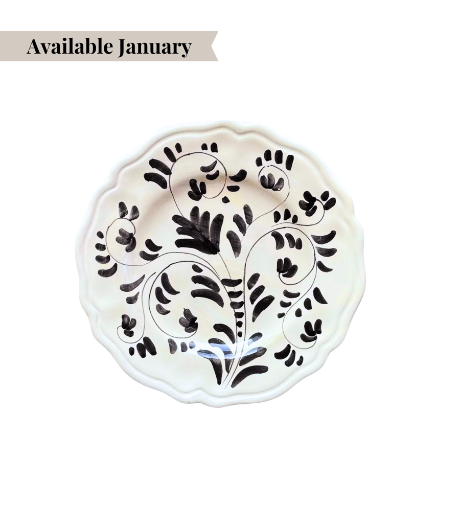 White ceramic bread plate with black floral pattern