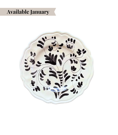 White ceramic bread plate with black floral pattern