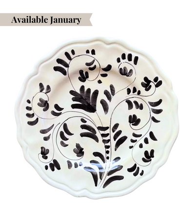 White ceramic charger plate with black floral pattern