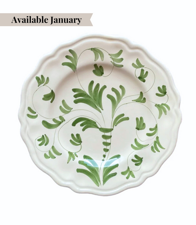 White ceramic charger plate with green floral pattern