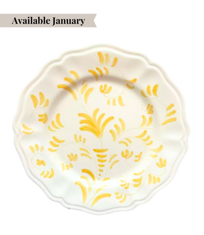 White ceramic charger plate with yellow floral pattern