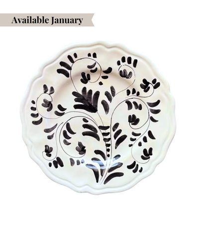 White ceramic dinner plate with black floral pattern