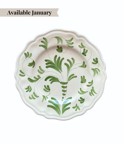 White ceramic dinner plate with green floral pattern