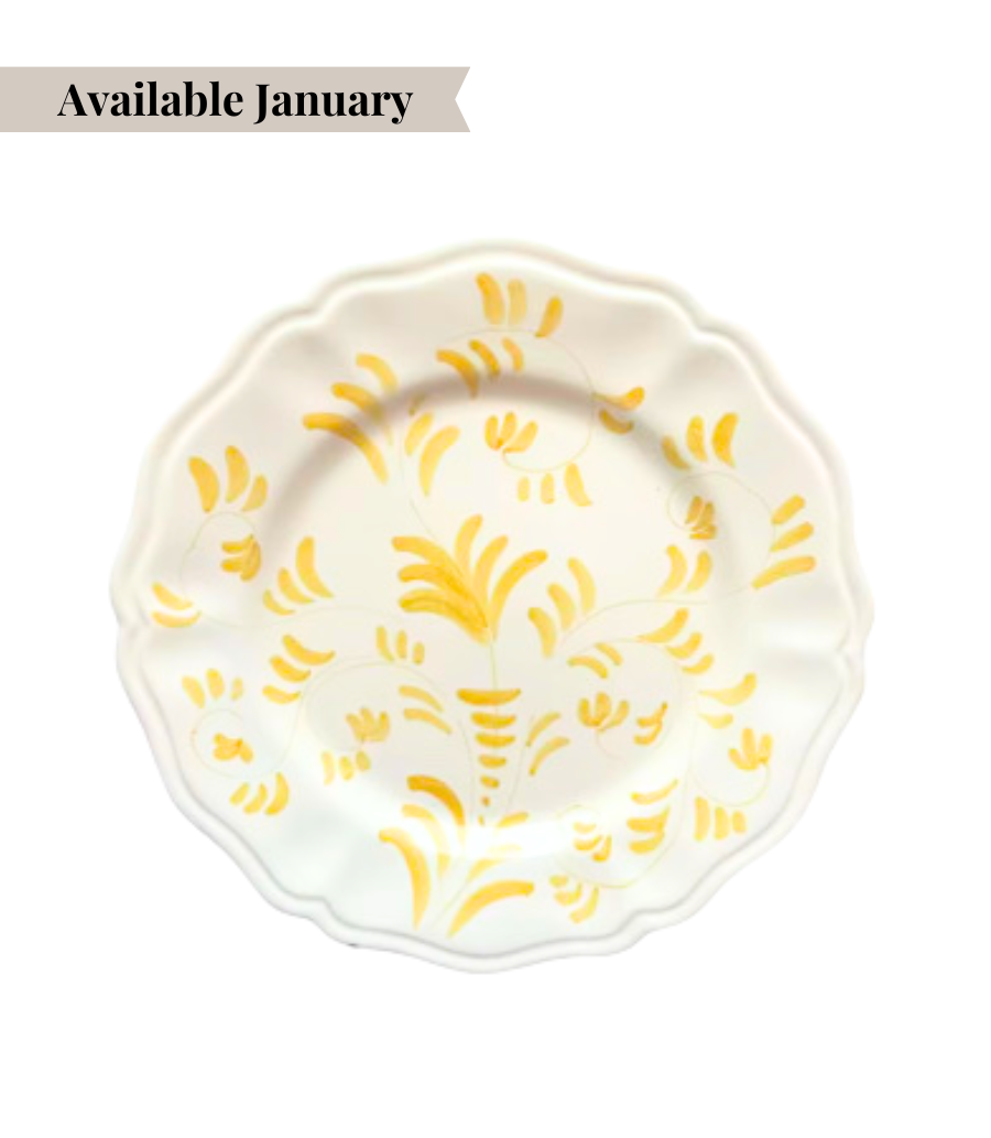 White ceramic dinner plate with yellow floral pattern