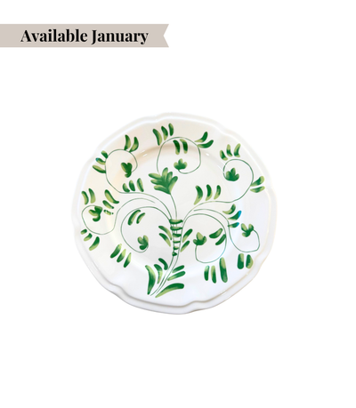 White ceramic bread plate with green floral pattern