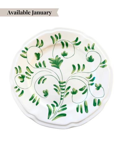 White ceramic charger plate with green floral pattern