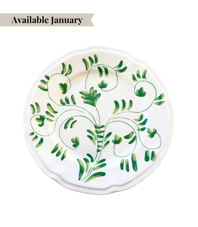 White ceramic dinner plate with green floral pattern