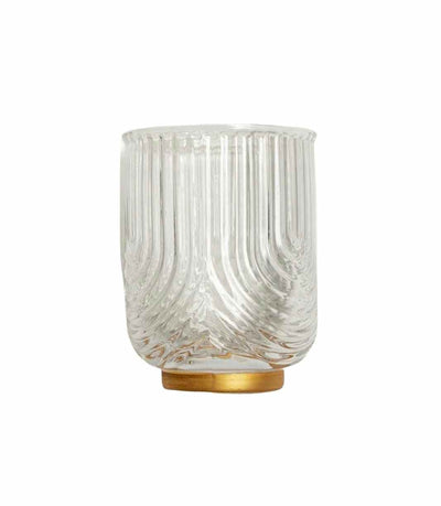 clear water tumbler with textured surface and brushed gold base