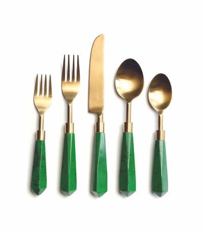 gold cutlery with a green acrylic handle