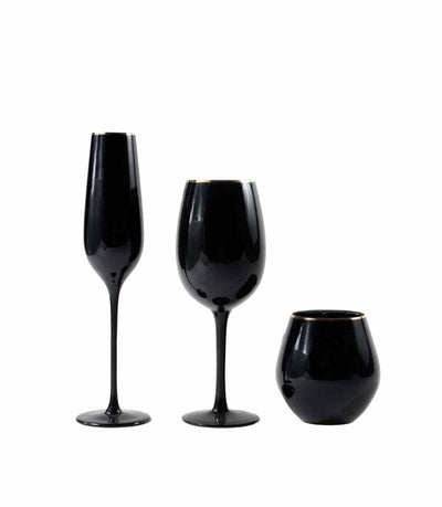 black glassware with a gold rim
