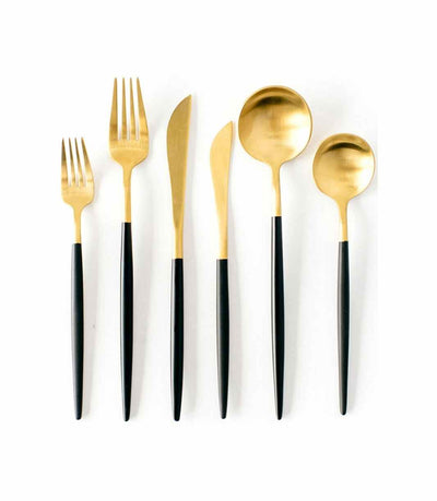 sleek gold cutlery with a black handle