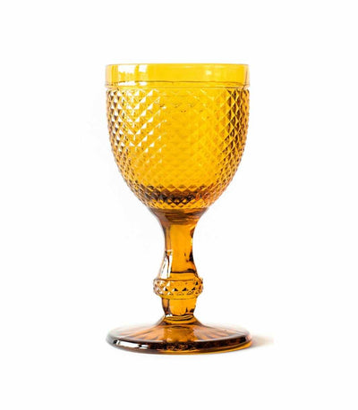 amber water goblet with textured surface