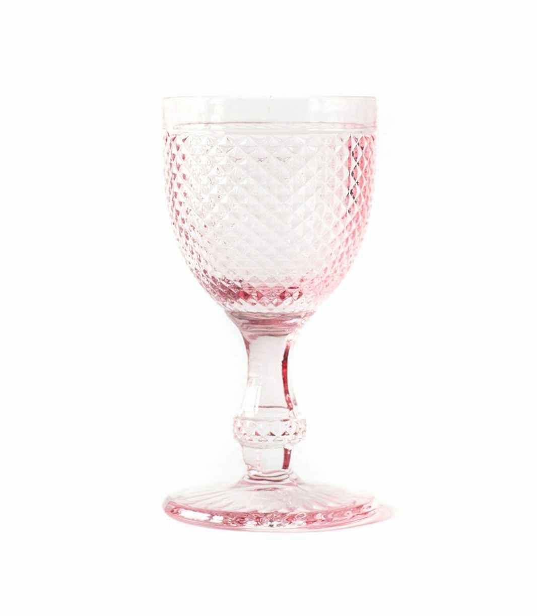 pink water goblet with textured surface