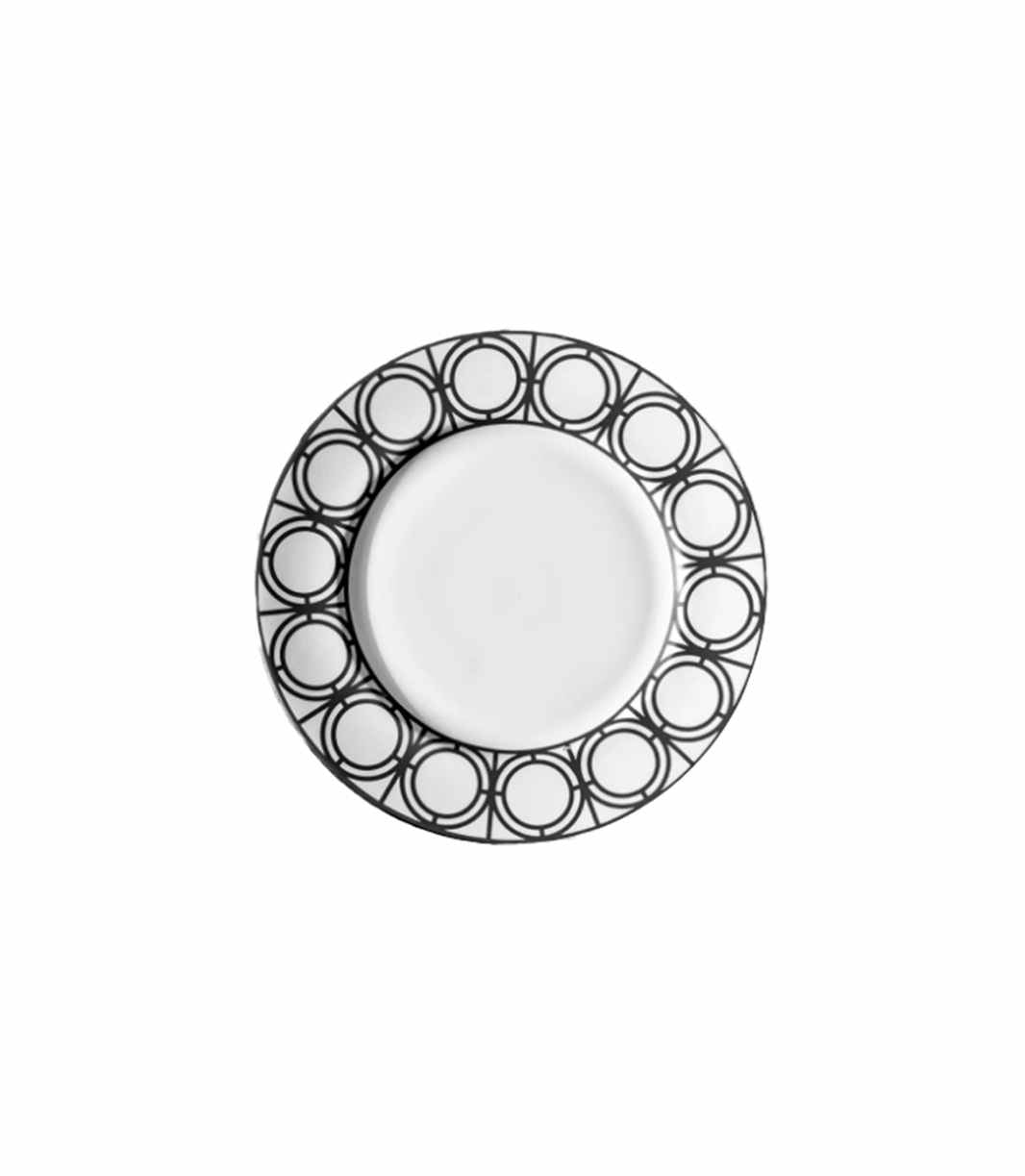 white bread plate with black geometric patterned rim