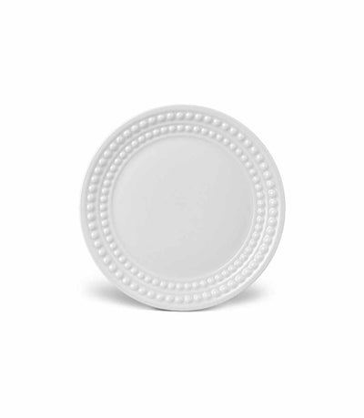 white porcelain bread plate with rows of raised pearls around the rim
