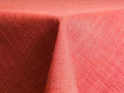textured coral coloured tablecloth