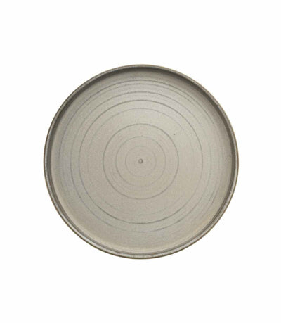 ceramic charger plate with earthy matte finish and raised rim